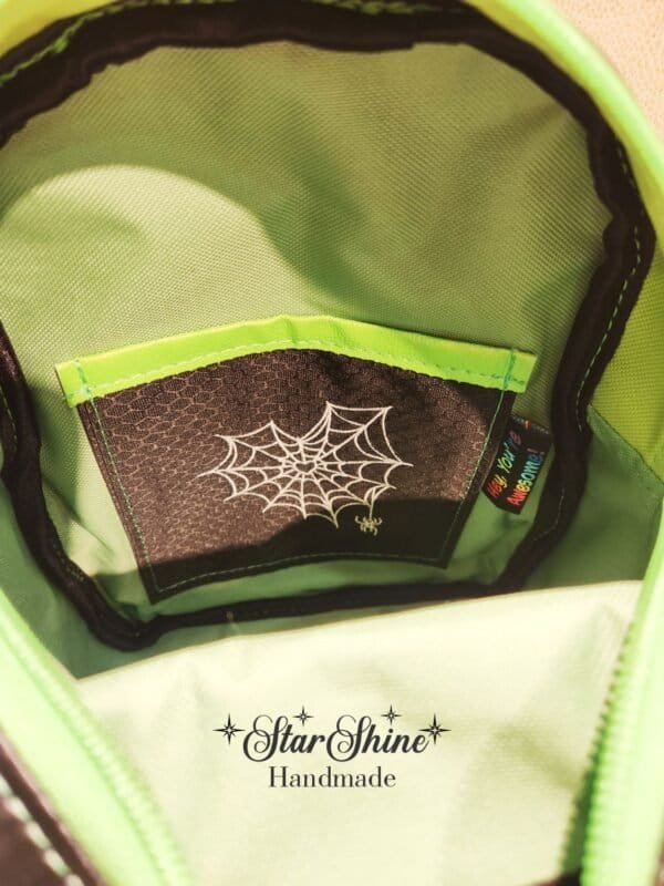 Metallic Green Gothic Sling Bag With Custom Embroidery - Closeup of interior embroidery