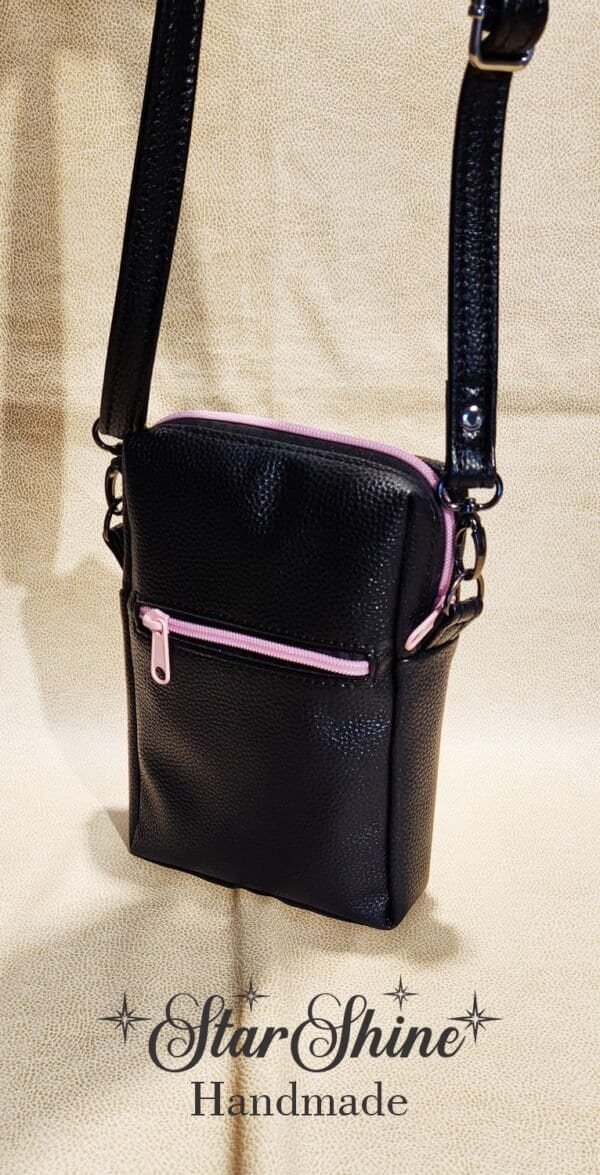 Black Striped Pixie crossbody in a gorgeous striped pink rose print. Rear view