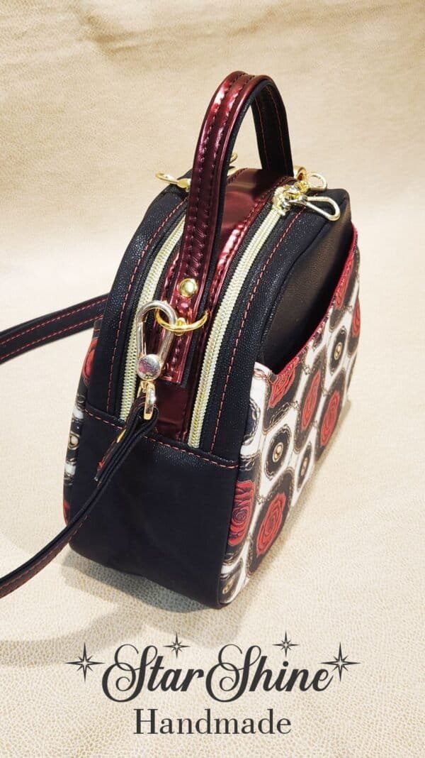 Black and Red Rose Mini E Bowler Crossbody Bag. Side View