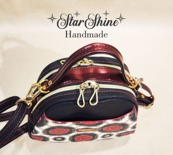 Black and Red Rose Mini E Bowler Crossbody Bag. Top View